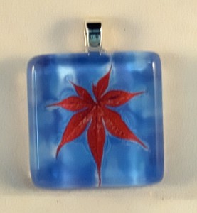 Maple leaf in water, fused glass pendant